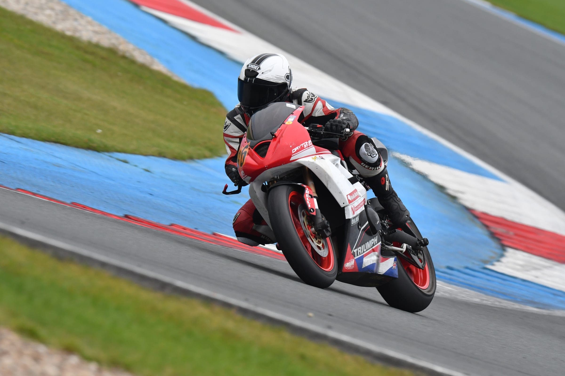 Motorcycle cornering at speed on a race circuit
